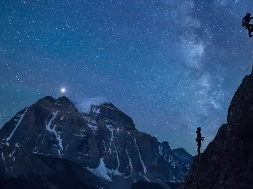 climbers on a mountain at night, photo by Paul ZIzka for Banff Mountain Festival