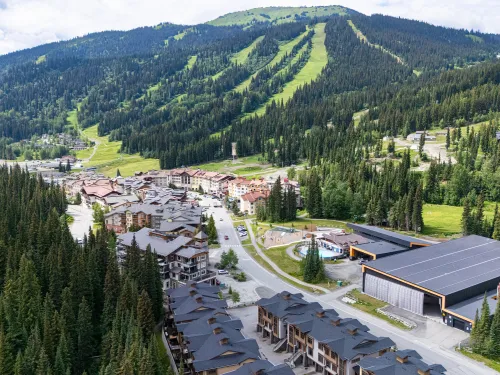 Sun Peaks Centre festival venue, seen from above, tying festivals into alpine beauty.