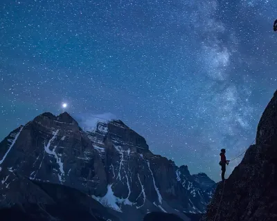 climbers on a mountain at night, photo by Paul ZIzka for Banff Mountain Festival