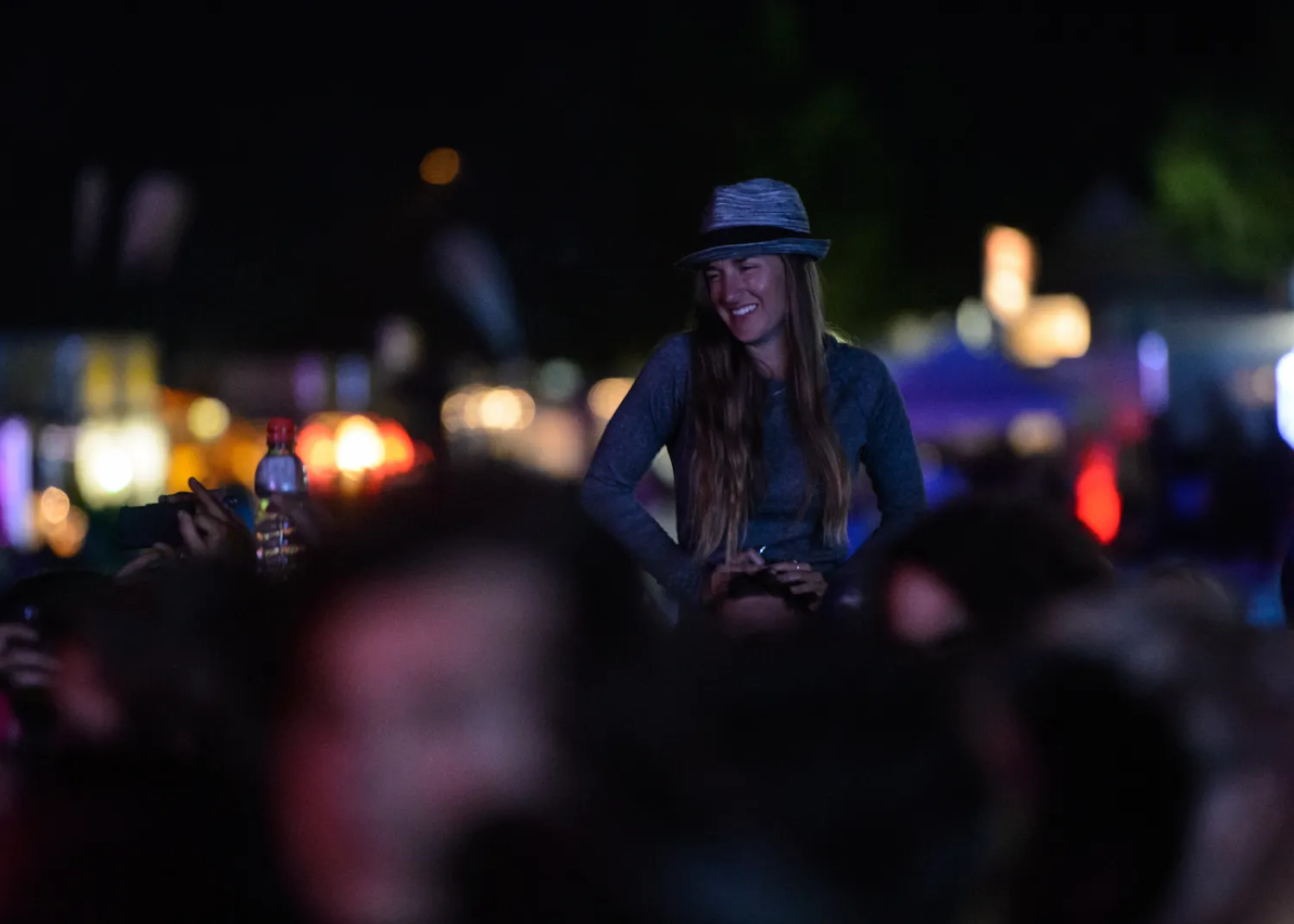 music festival crowd on shoulders